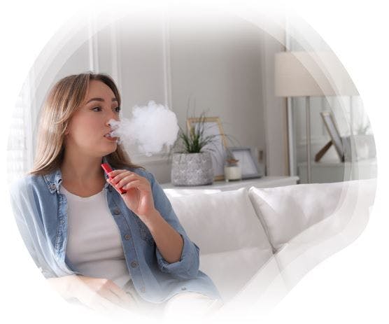 Preconception Vaping, Alcohol Use Had “No Meaningful Association” with Spontaneous Abortion in New Study / image credit - woman vaping: ©Africa Studio/stock.adobe.com