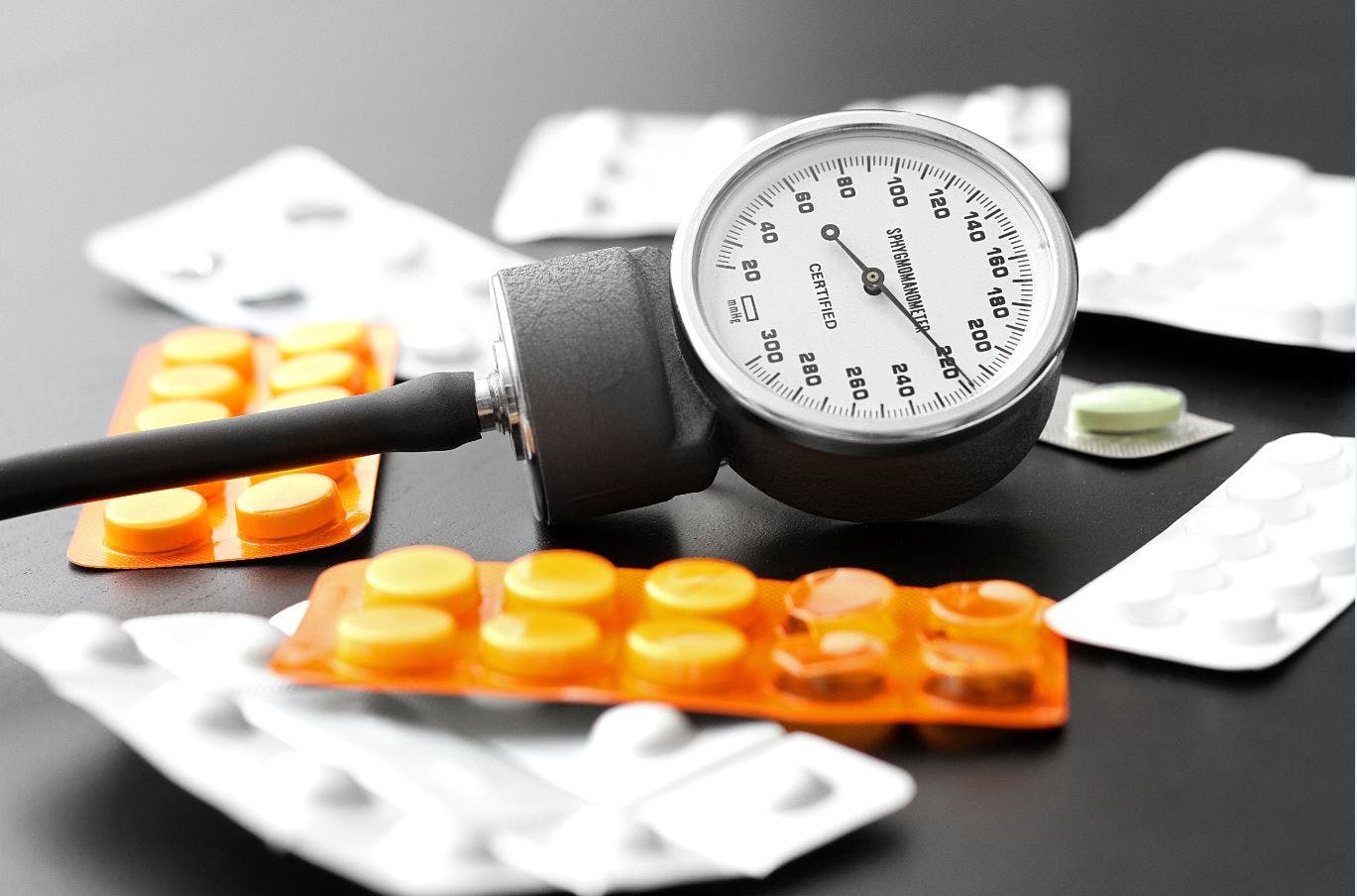 Zilebesiran Reduces Hypertension as Addition to Standard of Care in Phase 2 KARDIA-2 Trial / image credit blood pressure cuff and medications: ©Rostick/stock.adobe.com