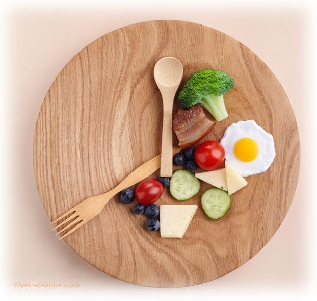 Early Time-restricted Feeding Regimen Improves Glycemic Variability, Time in Range in Patients with Prediabetes, Obesity  food clock image ©vertre/stock.adobe.com
