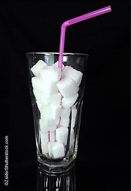 Sugar cubes in a glass with straw ©Zsido/Shutterstock